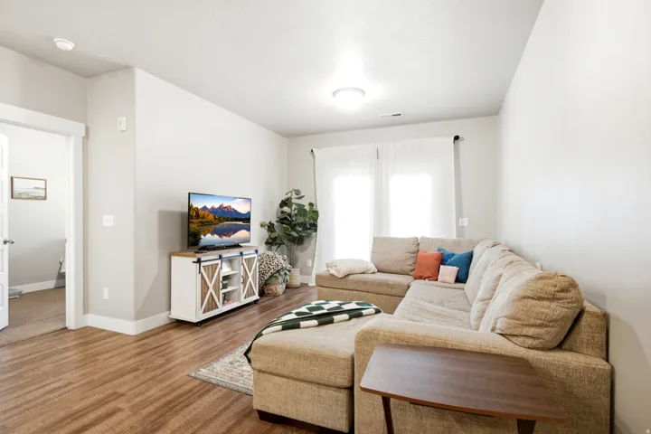 Spacious interior featuring wood-finish flooring and neutral wall tones