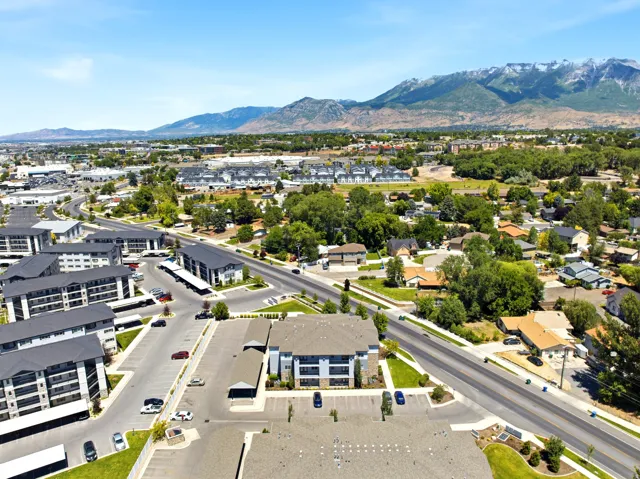 Expansive aerial perspective showcasing a developed community with a prominent mountainous backdrop