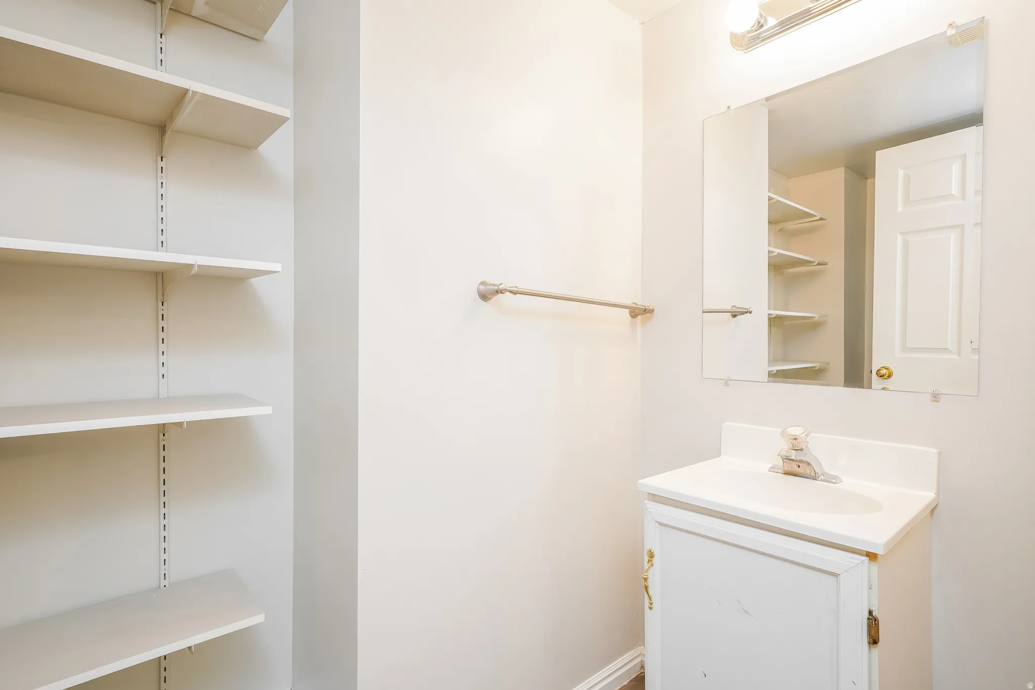 Bathroom vanity with an integrated sink and base cabinet storage