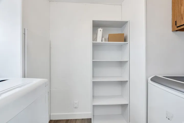 Built-in shelving unit with five white shelves