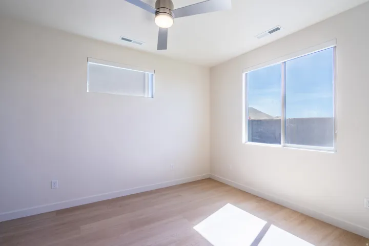 Bright interior space featuring light-toned wood-finish flooring