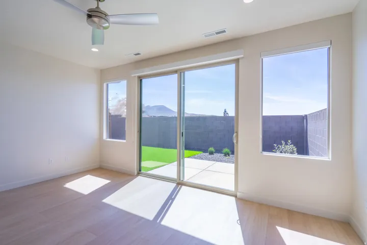 Interior space with wood-finish flooring, a modern ceiling fan, and recessed lighting