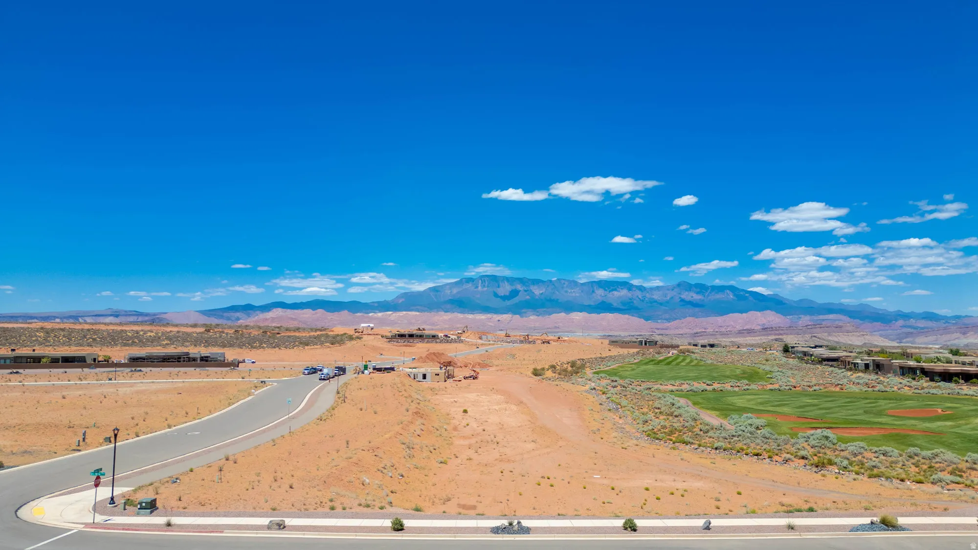 Expansive vacant land parcel featuring direct highway access via newly constructed paved road frontage