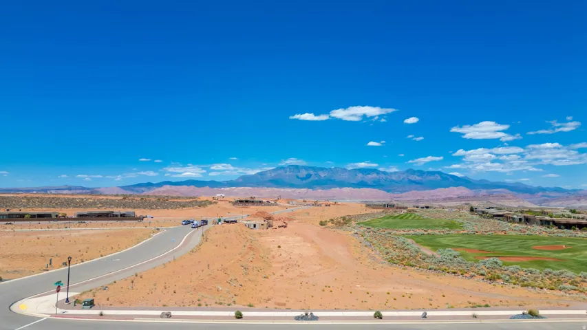 Expansive vacant land parcel featuring direct highway access via newly constructed paved road frontage