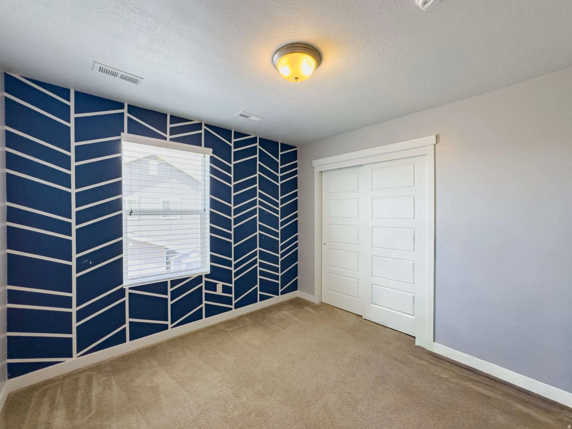 Secondary bedroom in northwest corner of home