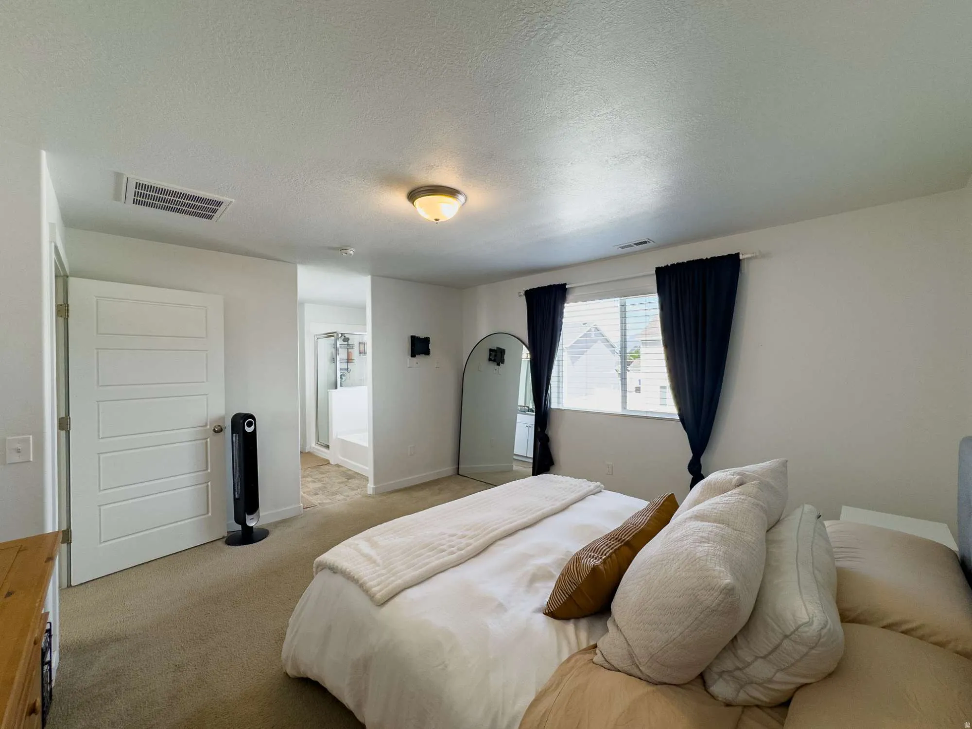 Master Suite showing east facing widnow and entrance to main bath
