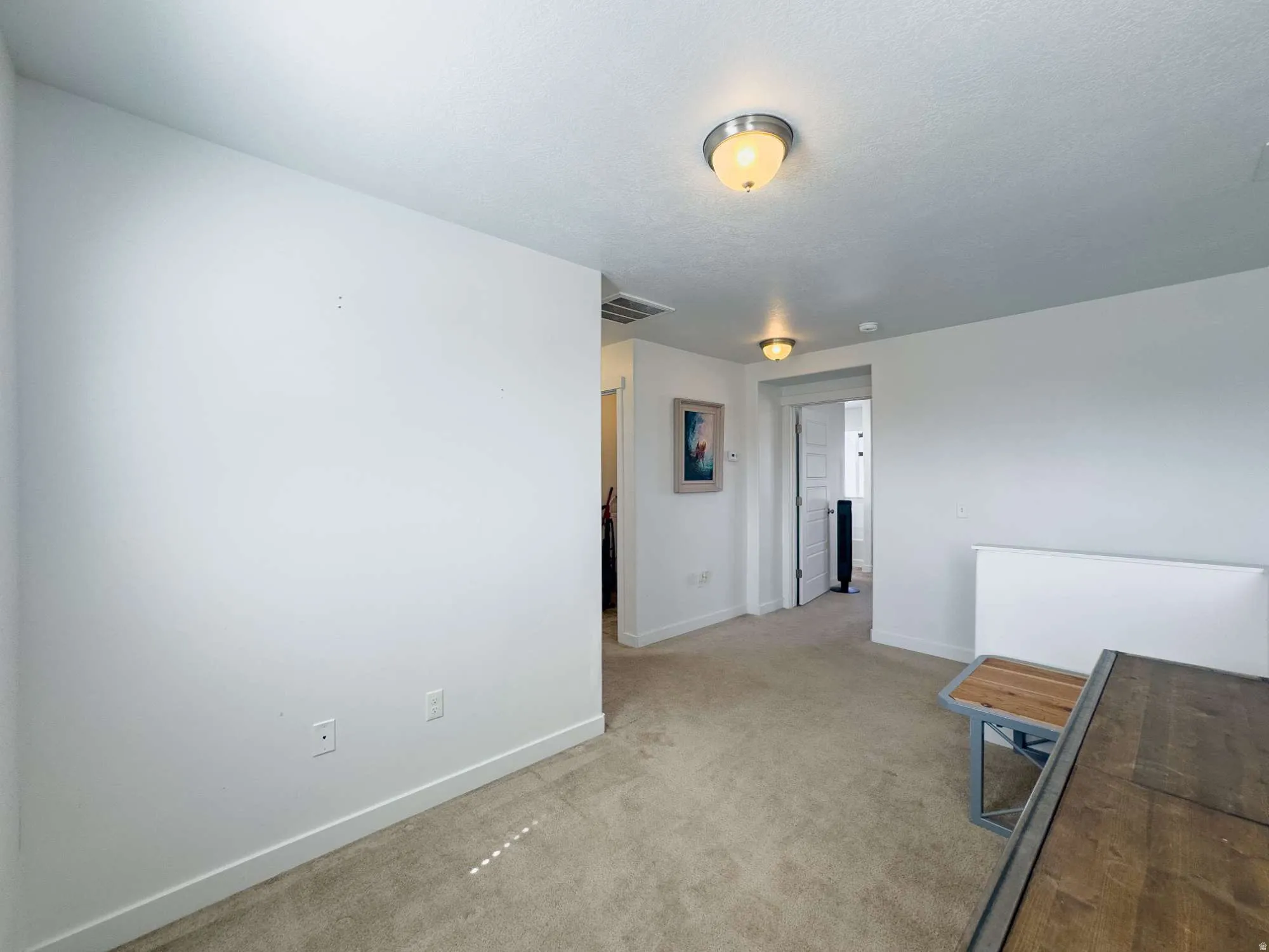 Spacious landing at top of stairs. Can be used as play area or office space.