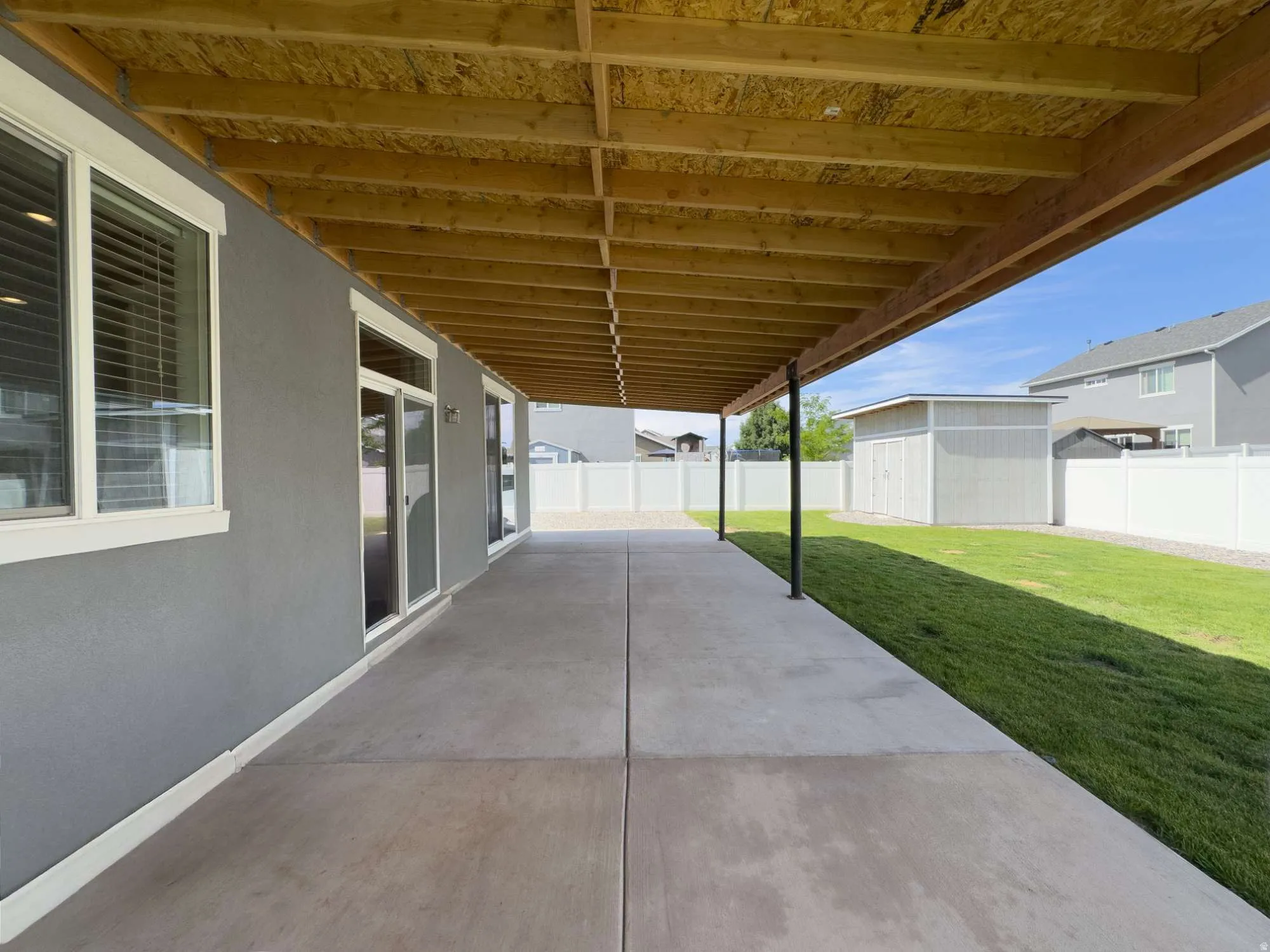 Covered patio, and vinyl privacy fence