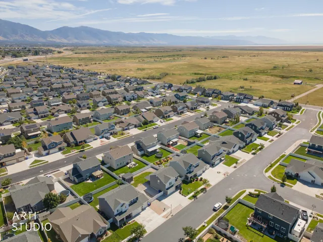 Residential neighborhood with varied architectural styles and fenced backyards