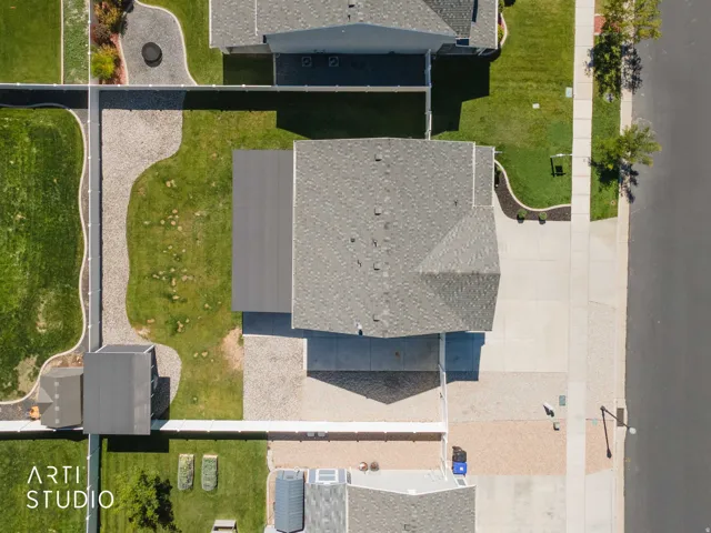 Overhead view of property showing front, and back yard, RV pad, and storage shed.