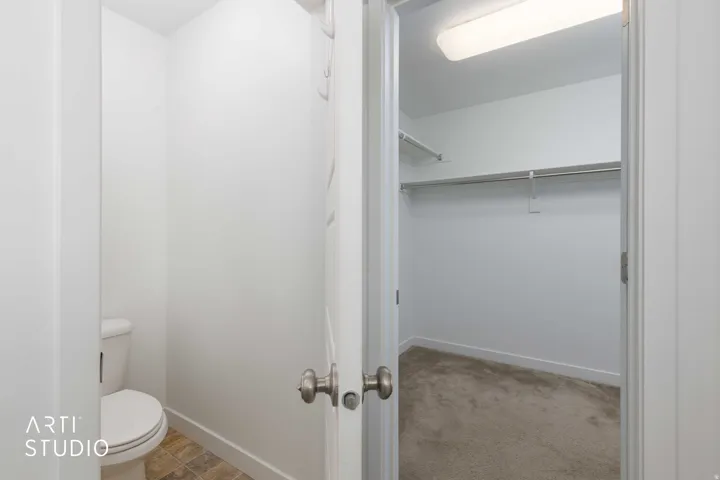 Primary Bedroom water closet featuring tile flooring