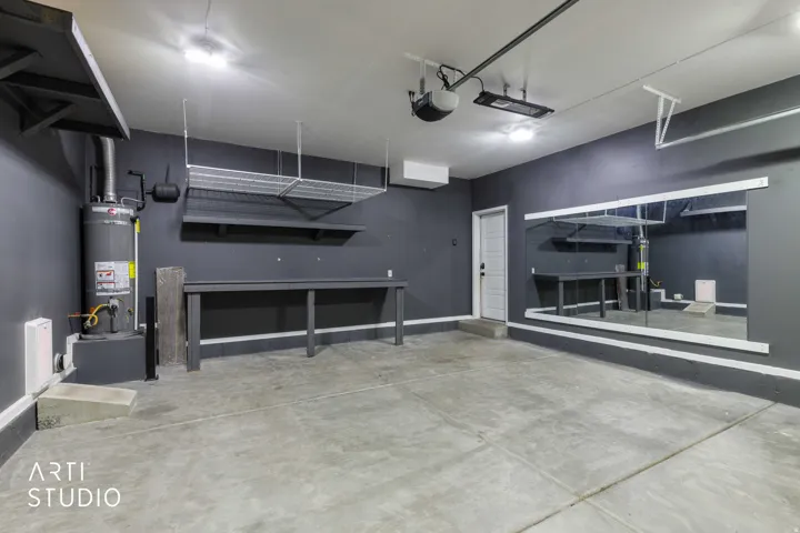 Concrete flooring, mounted shelving, and built-in workbench