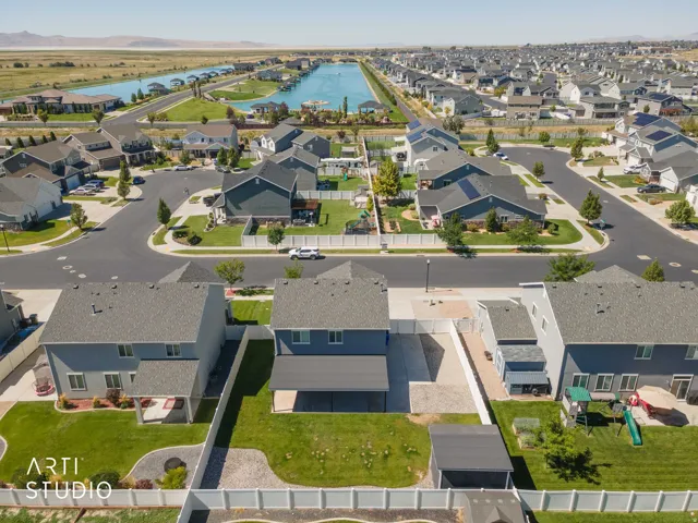 Residential neighborhood with a prominent canal, paved streets, and a mix of single-family homes