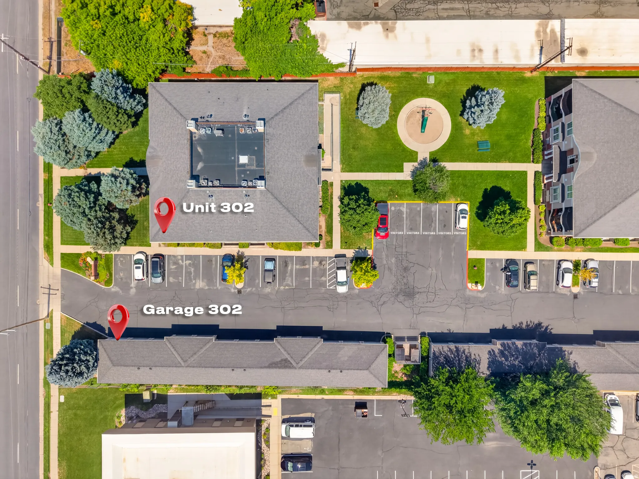 Aerial perspective showcasing Unit 302 and Garage 302 within a multi-building complex