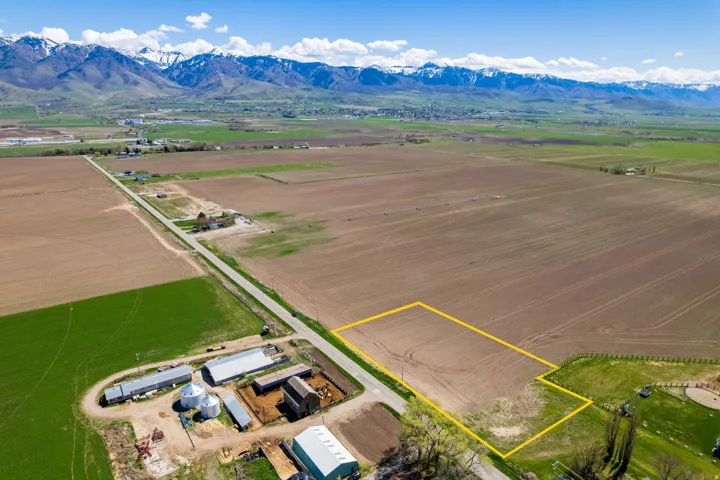 Expansive agricultural property featuring approximately 40+ acres of productive farmland with established irrigation infrastructure