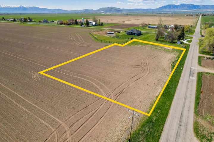 Expansive agricultural parcel featuring approximately 40+ acres of productive farmland with established irrigation infrastructure