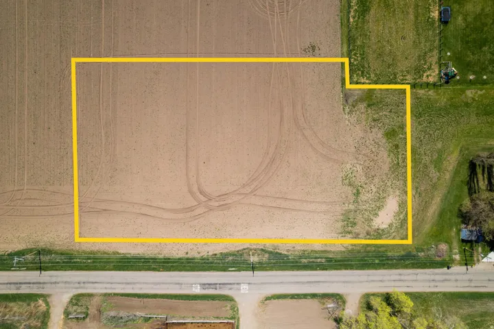 Aerial Property Survey. Depicting the outlined parcel boundaries and land configuration as viewed from above