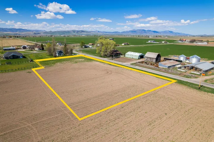 Substantial agricultural land parcel featuring approximately 40+ acres of cleared, tillable soil with defined boundaries