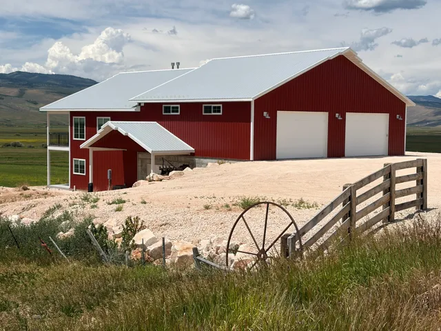 Red exterior with white trim and a light gray metal roof