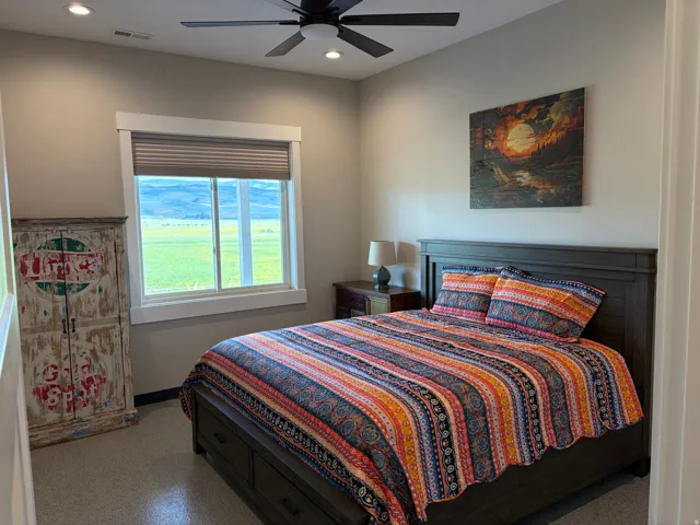 Window with a rural landscape, recessed lighting, and a ceiling fan