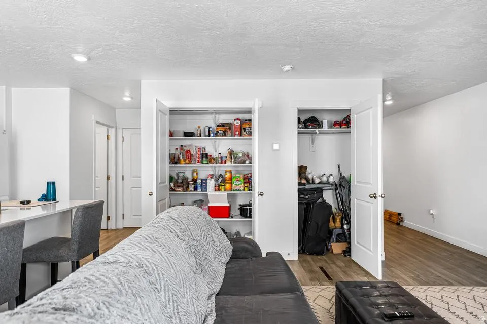 Interior living space featuring white walls and recessed lighting