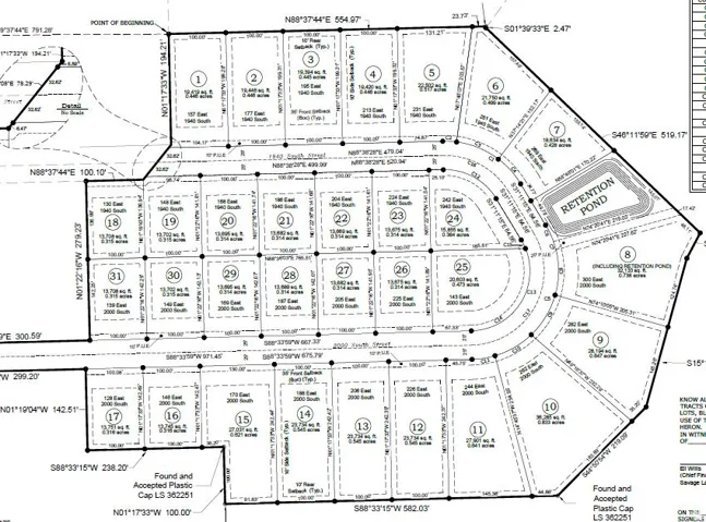 Subdivision Plat. Illustrating the layout of multiple property parcels, including dimensions and a retention area