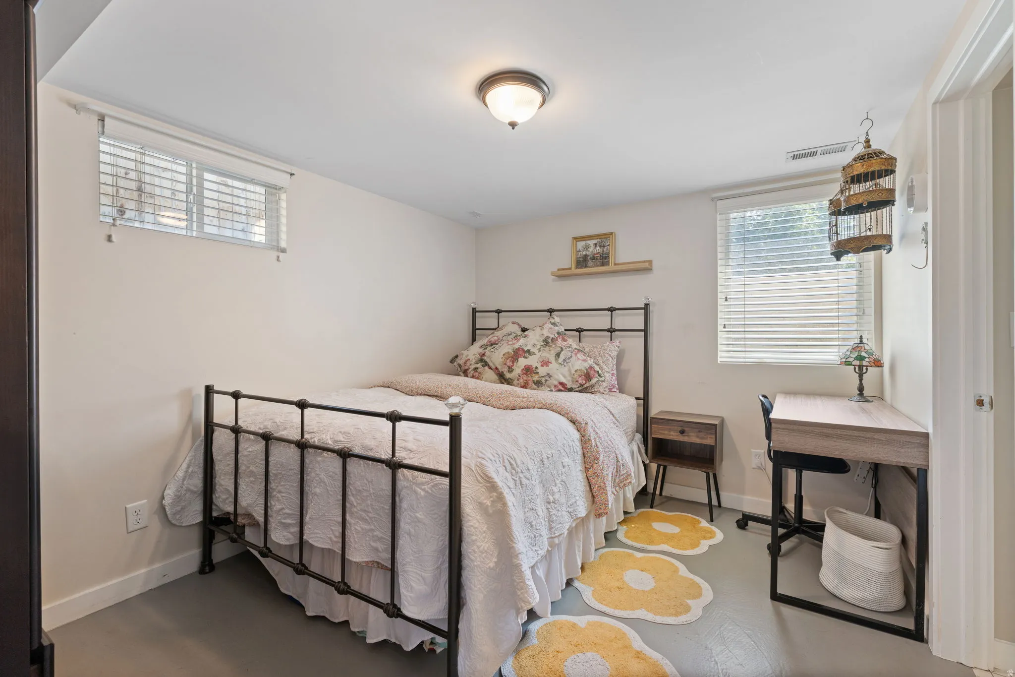 White painted walls with two windows featuring horizontal blinds, recessed lighting, and a neutral-toned ceiling