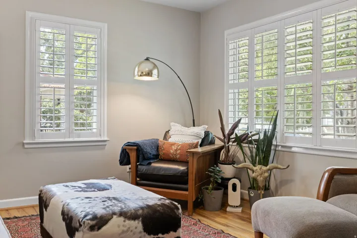Bright and versatile interior space flooded with natural light through dual sets of plantation shutters
