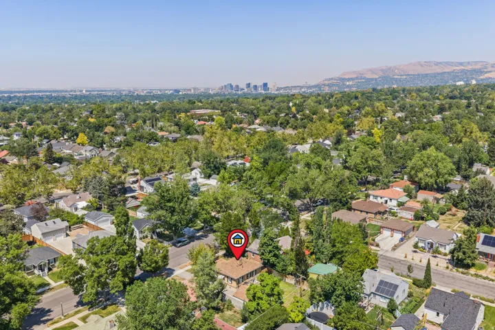 Aerial perspective showcasing this established residential property nestled within a mature tree-lined neighborhood