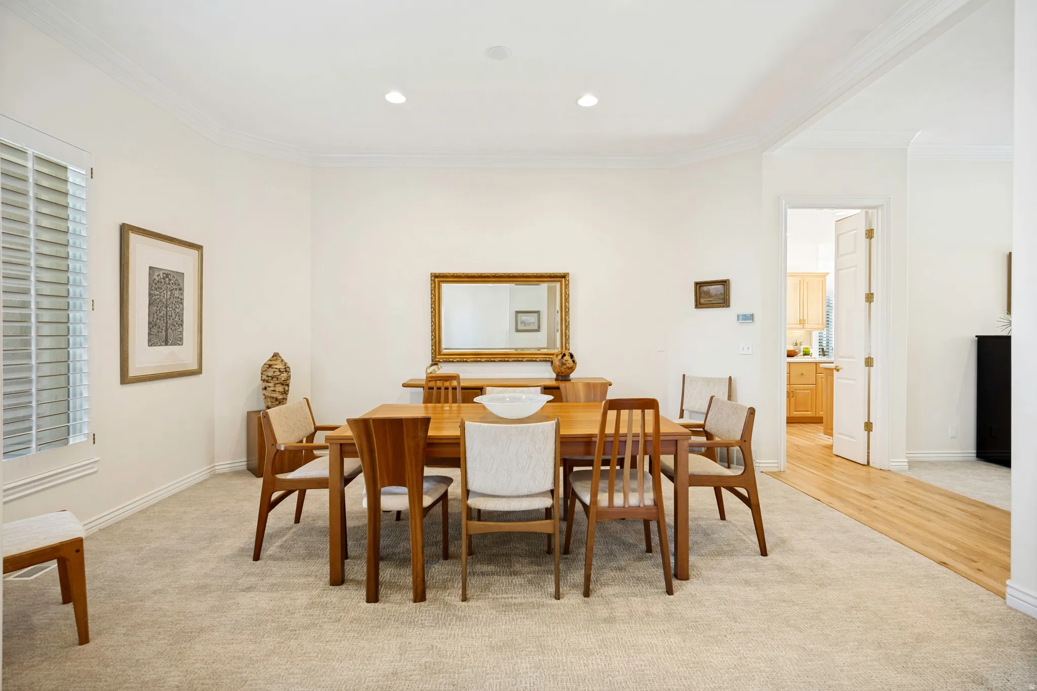 Dining area featuring recessed lighting, crown molding, and a neutral carpet