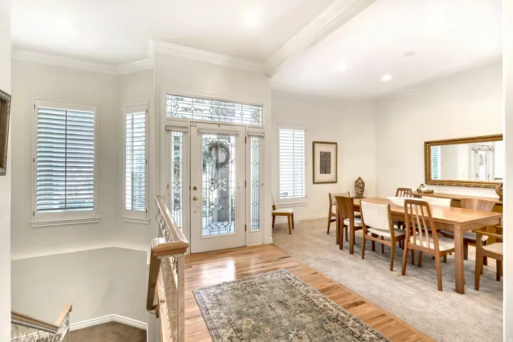 Double entry doors with decorative glass panels and sidelites