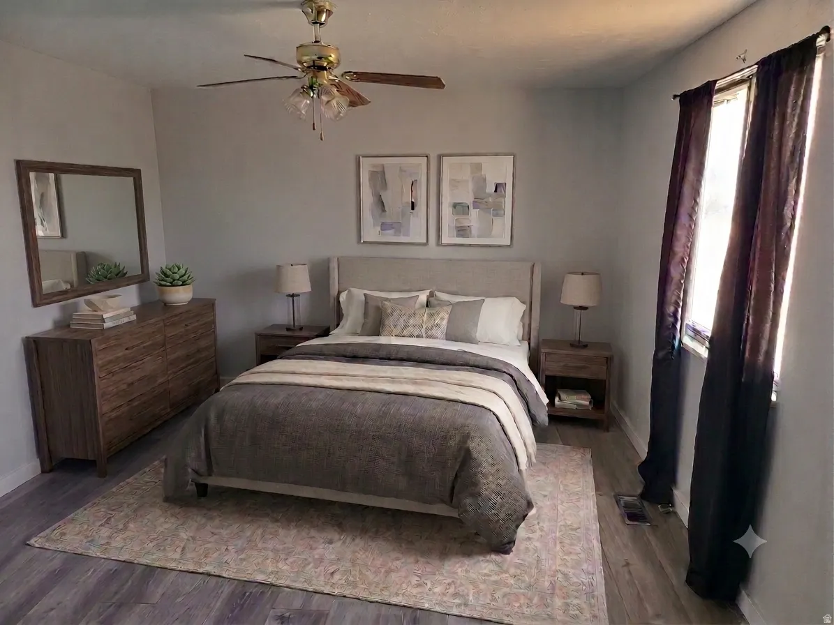 Wood-finish flooring with light gray walls and a ceiling fan
