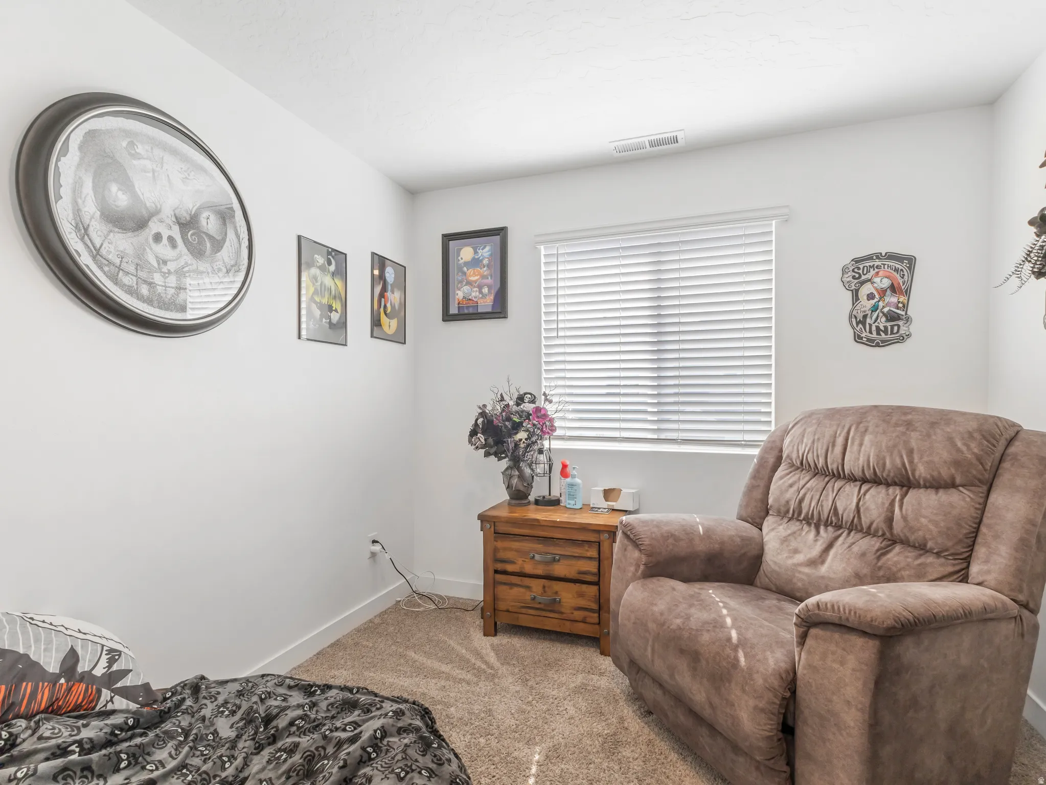 Room featuring light-colored walls and neutral carpeting