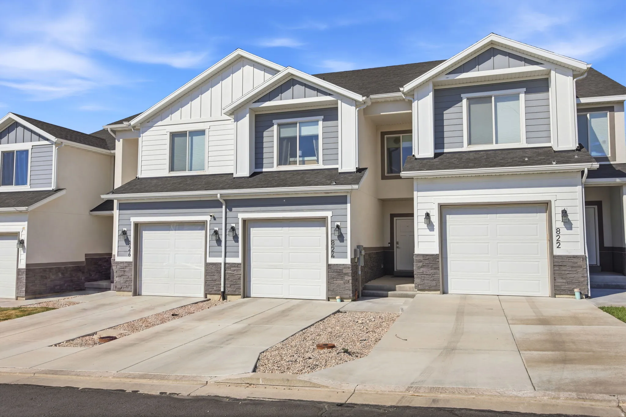 Contemporary townhome community featuring multiple two-story residences with clean architectural lines