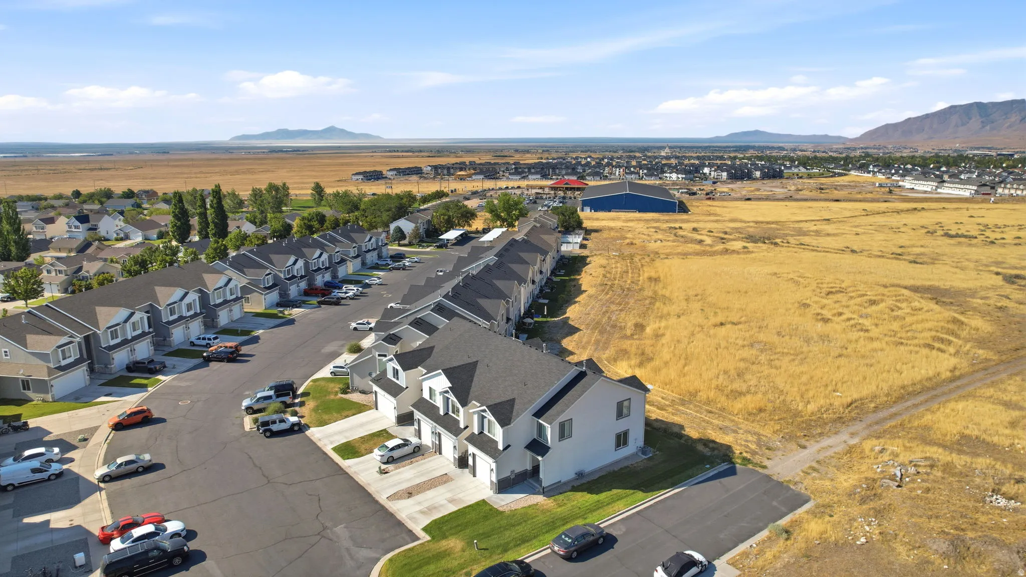 Striking two-story residence with modern architectural lines, situated on a corner lot within an established neighborhood