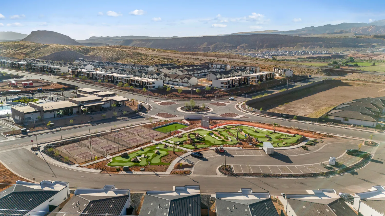 Community amenities featuring a miniature golf course, tennis courts, and a community clubhouse with an outdoor pool