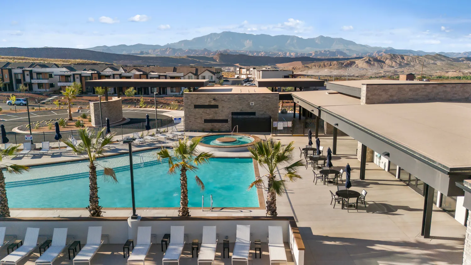 Resort-style pool with integrated spa and surrounding lounge areas