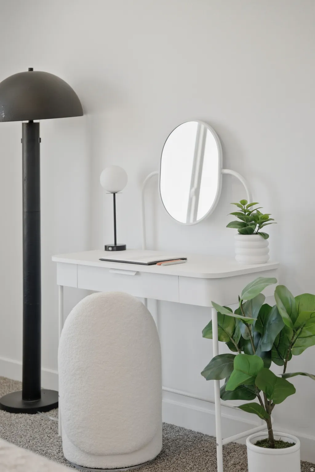 White desk with integrated drawer, paired with a textured cream stool