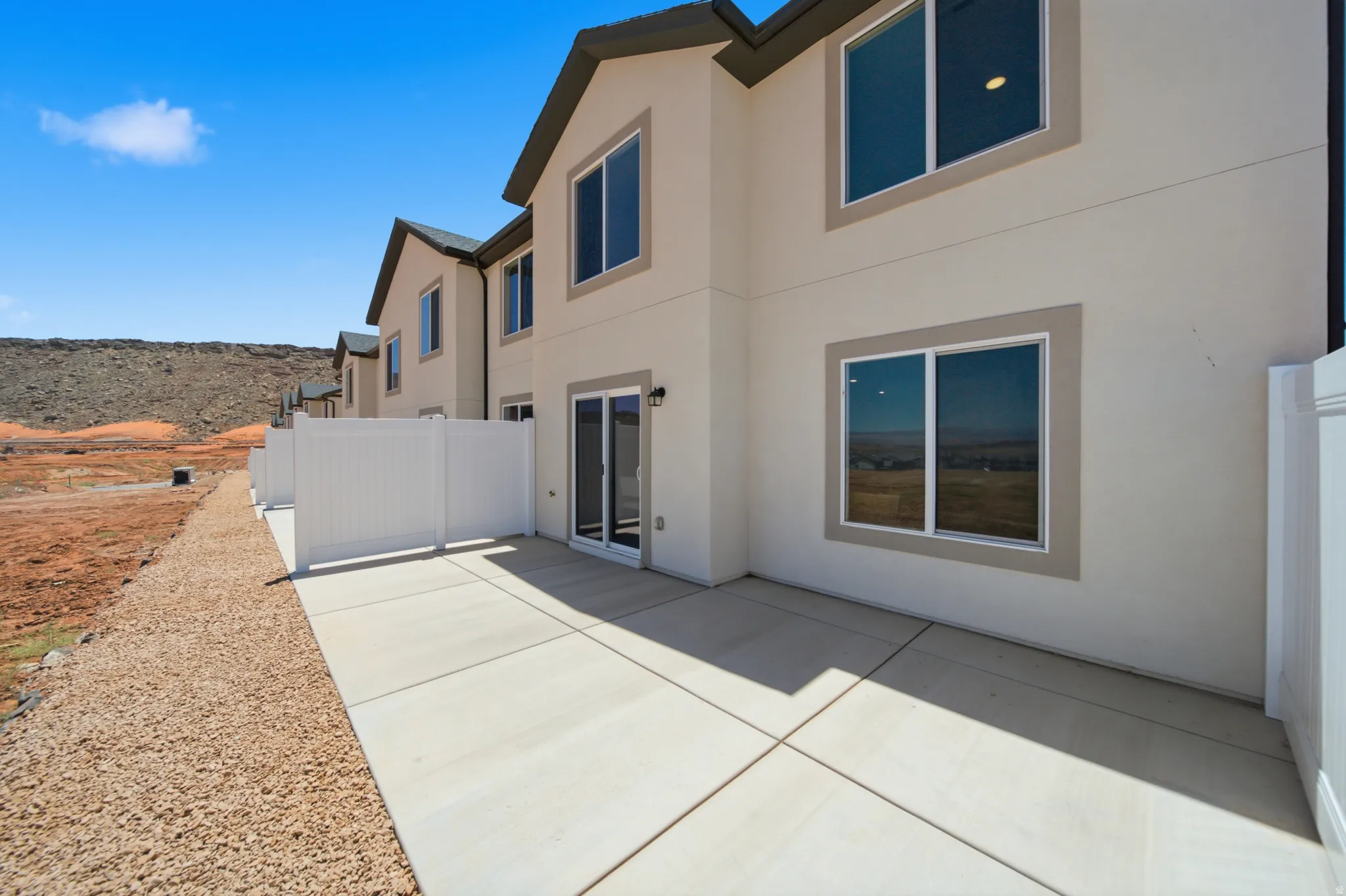 Expansive concrete patio with clean, geometric lines and seamless transitions