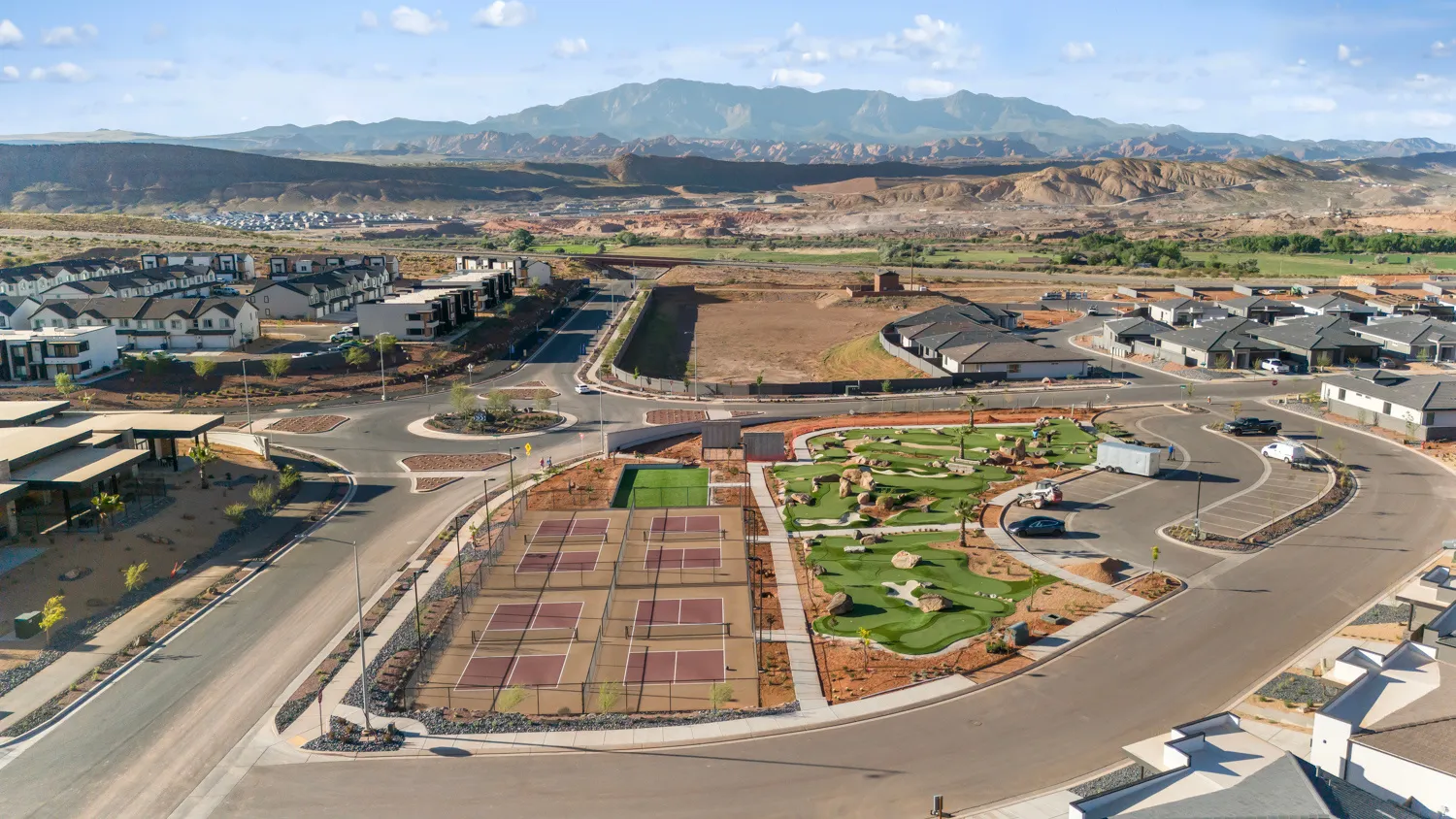 Community amenities featuring multiple pickleball courts, a miniature golf course, and landscaped common areas
