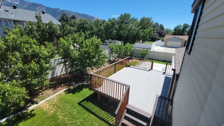 Spacious multi-level deck with wood-finish railings and composite decking