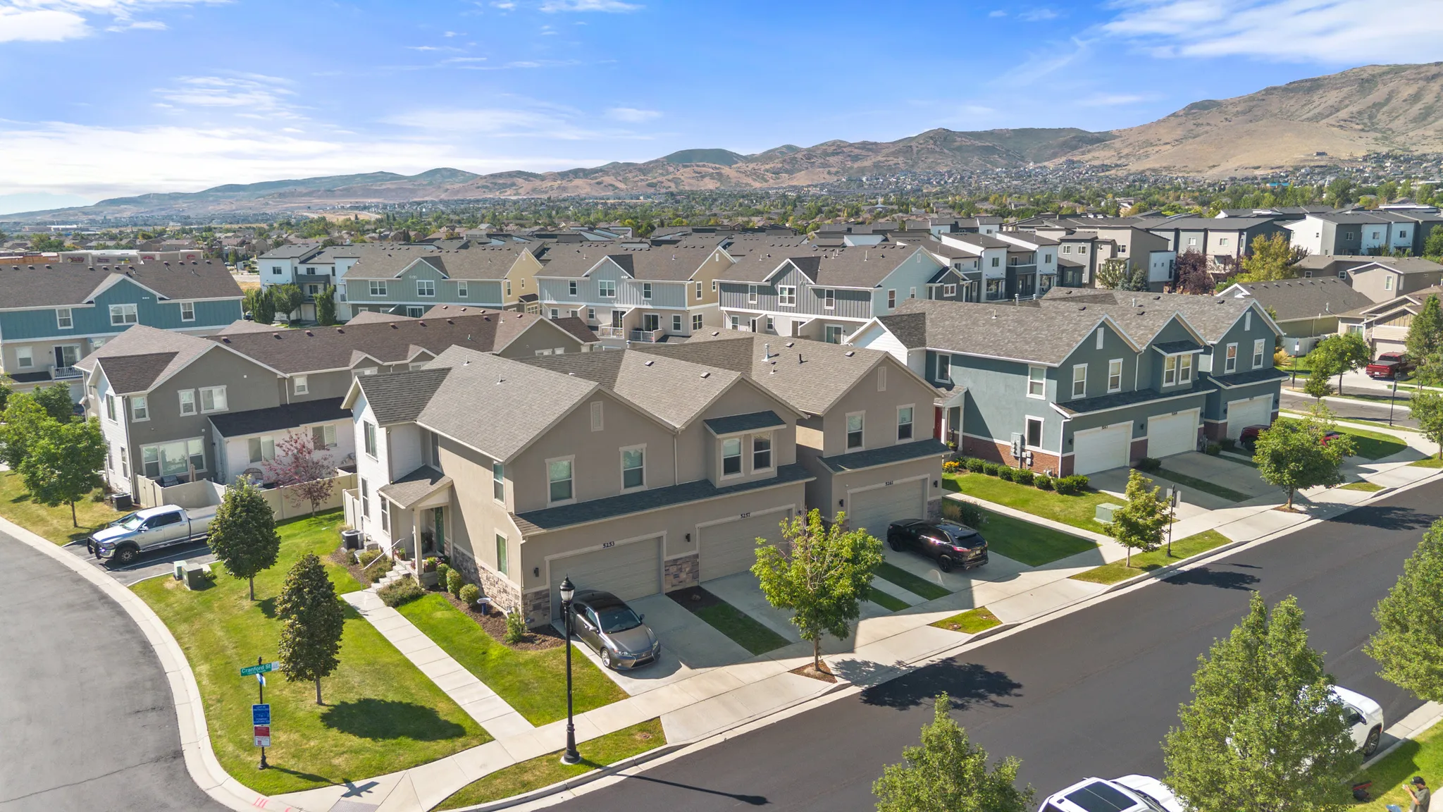 Established neighborhood featuring well-appointed two-story homes with multi-car garages, manicured landscaping, and paved streets
