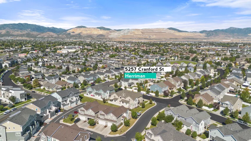 Aerial perspective showcasing a residential community with varying house styles and street layouts