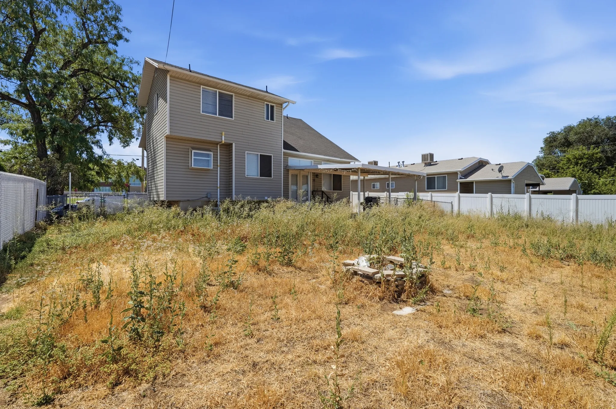 Spacious lot with mature landscaping and established trees, offering ample outdoor space