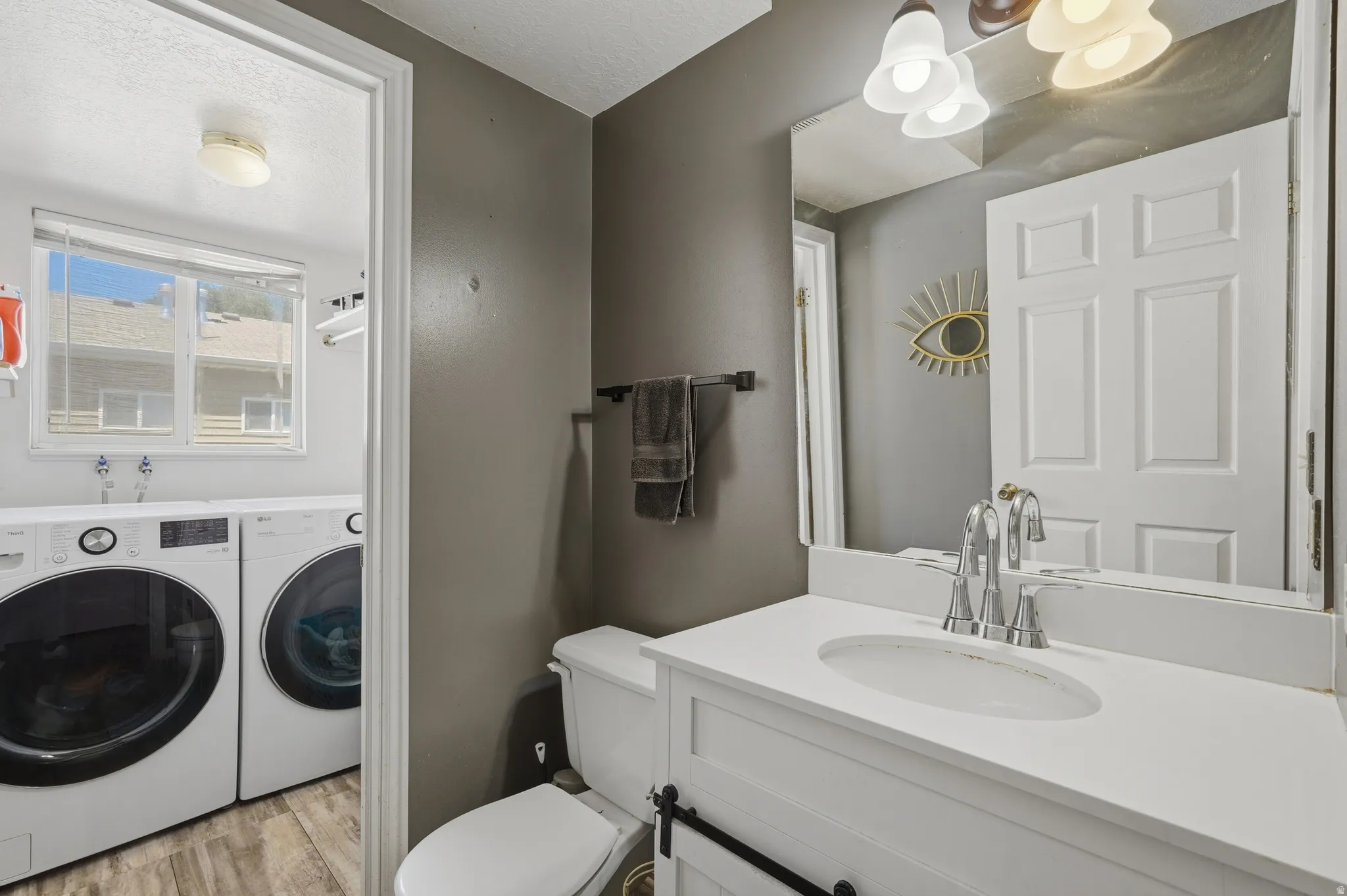 Primary Bathroom featuring a clean-lined vanity with an undermount sink, chrome faucet, and ample counter space