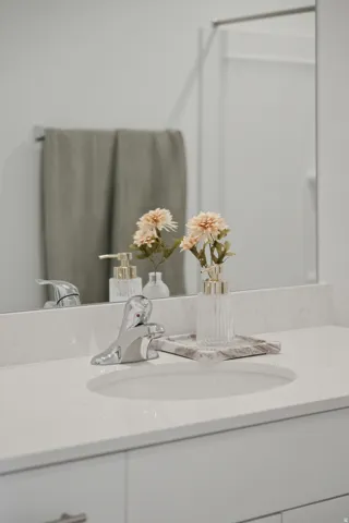 Integrated vanity with a white countertop and undermount sink