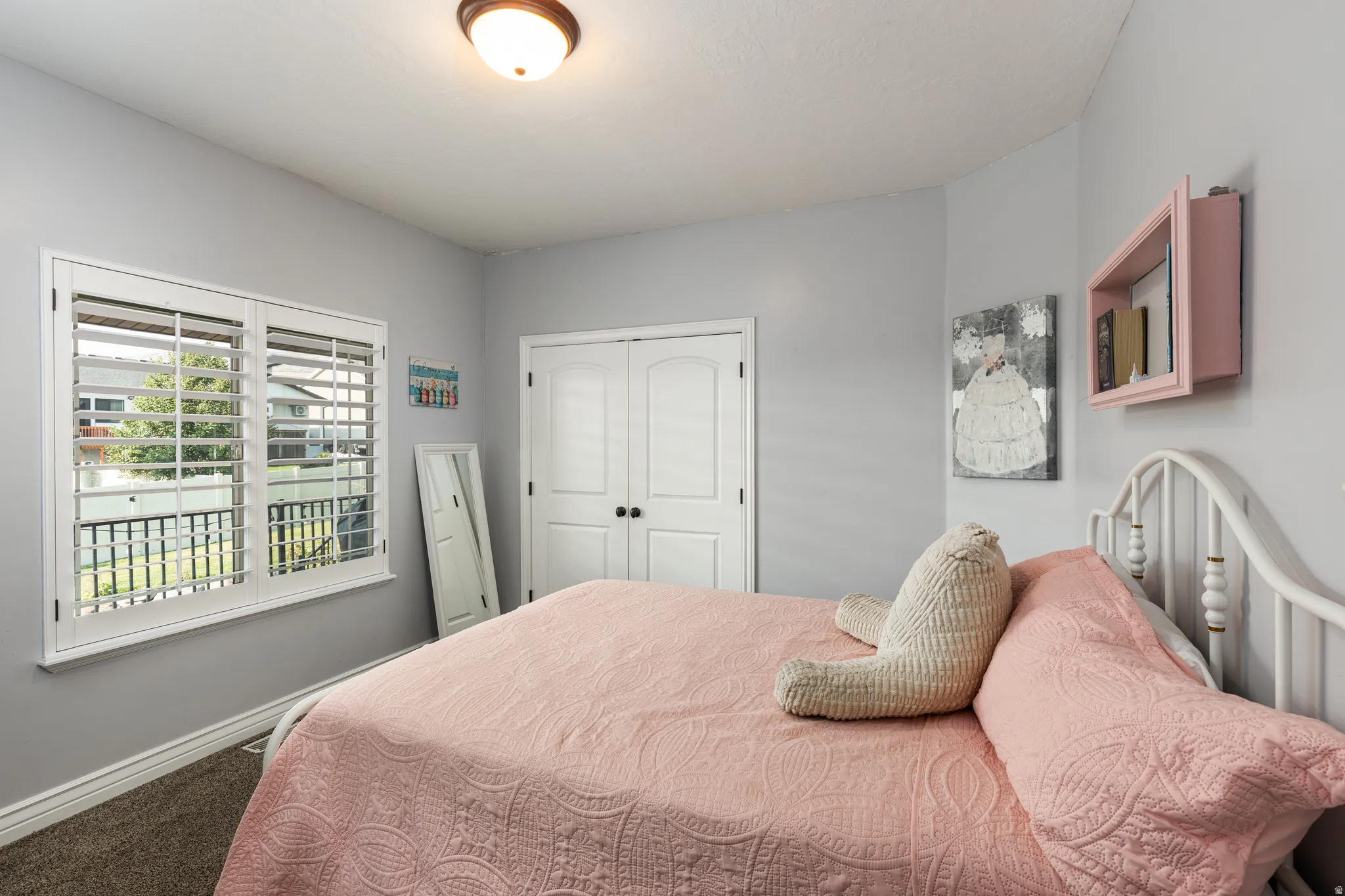 Bedroom featuring light gray walls and carpeted flooring