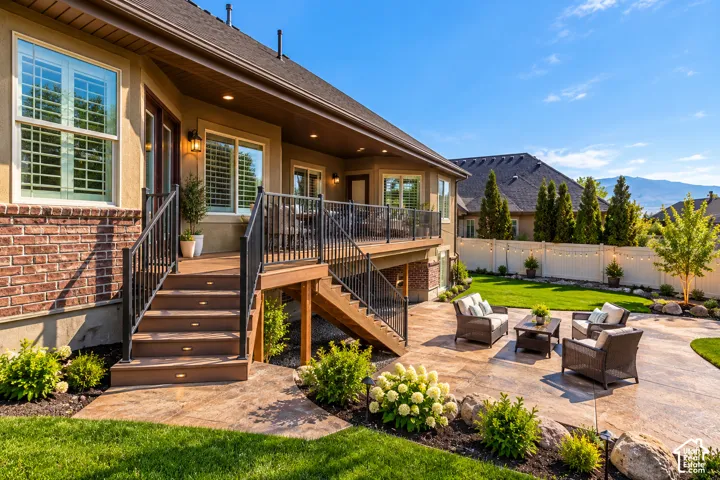 Expansive tiered patio with concrete and wood-finish decking