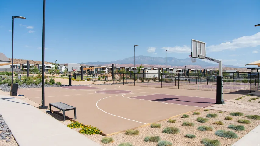 Outdoor recreational courts featuring a basketball court and multiple pickleball courts