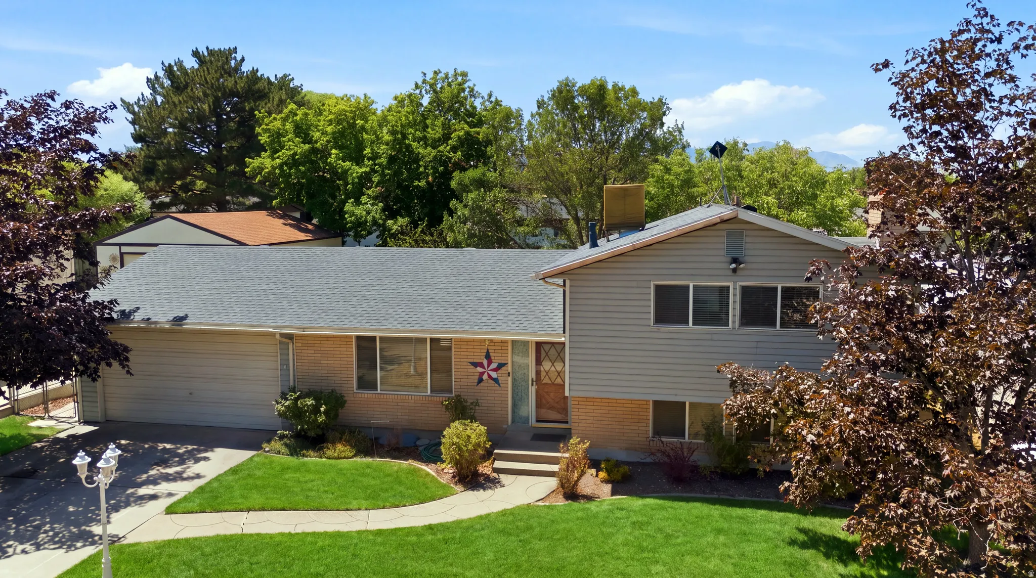 Grass has been virtually enhanced in this image to illustrate the property's outdoor potential.